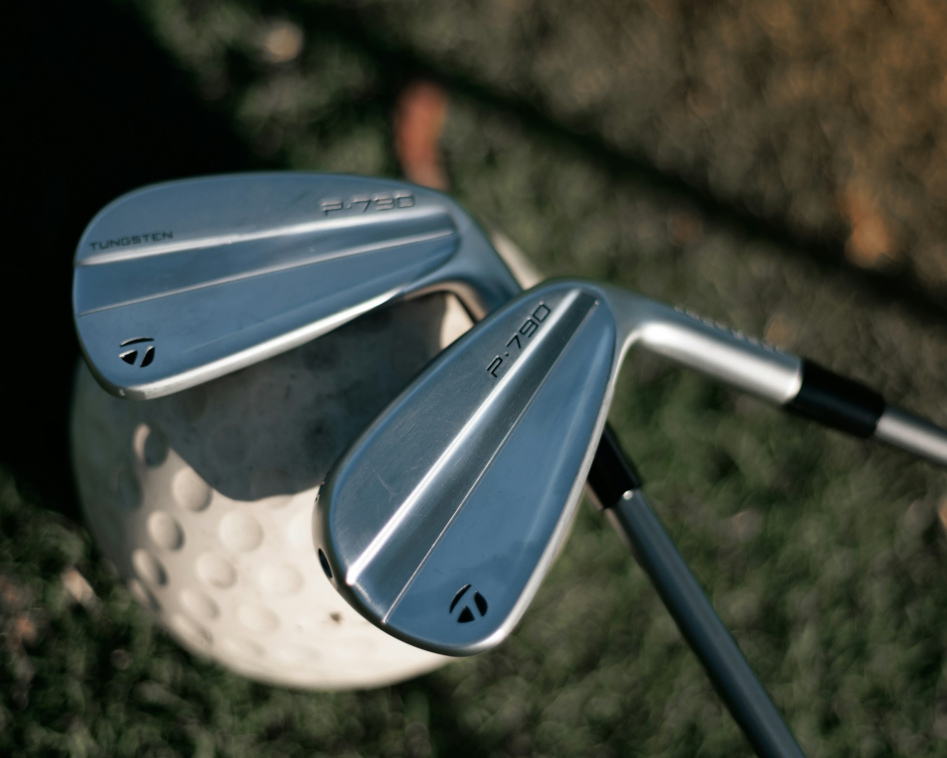 a close up of a golf club and driver