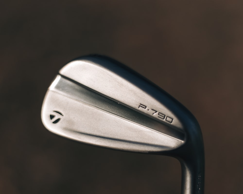 a close up of a golf club head