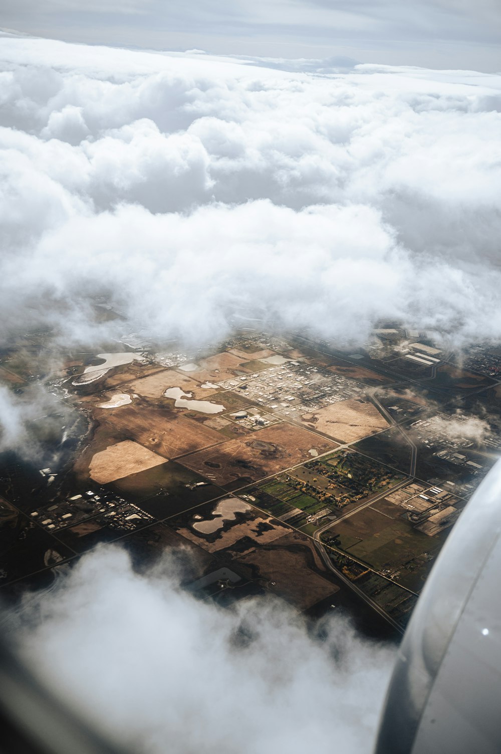 an aerial view of a city in the clouds