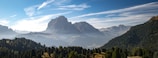 A panoramic view of the Serra do Cipó mountain range under a clear sky.