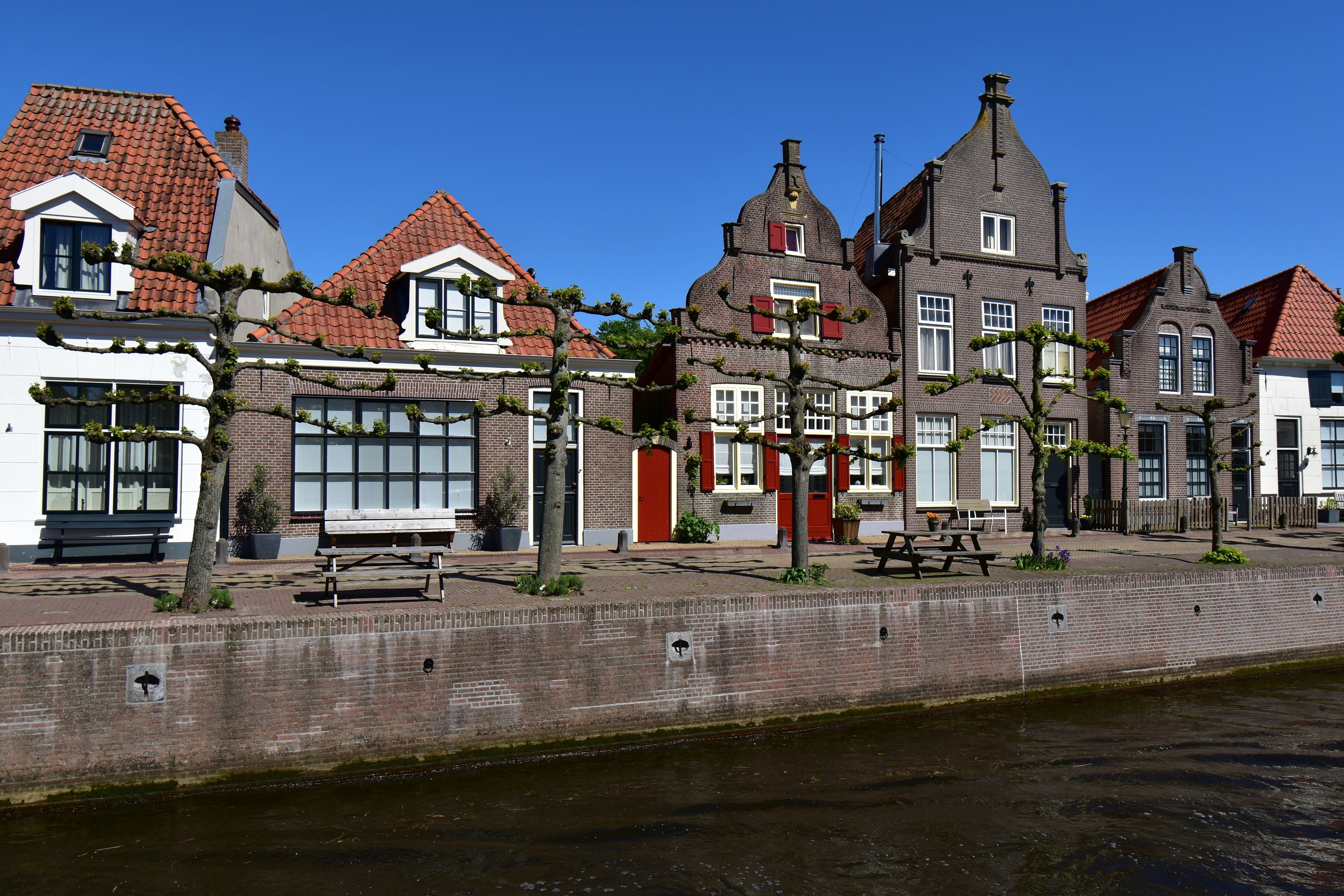 a row of houses next to a body of water