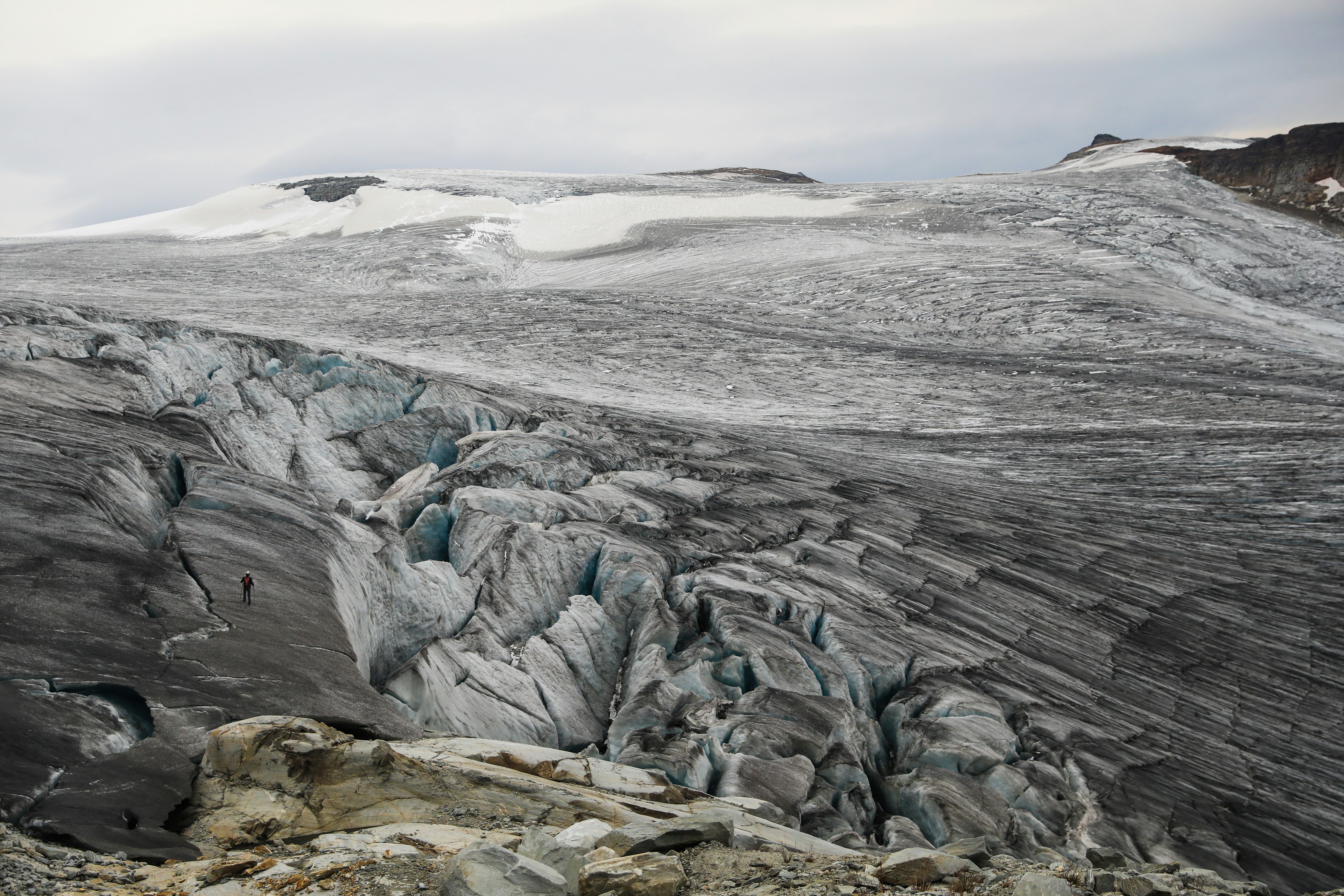 a large glacier with a mountain in the background, 