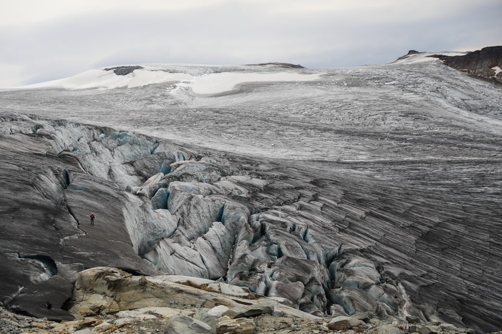 a large glacier with a mountain in the background