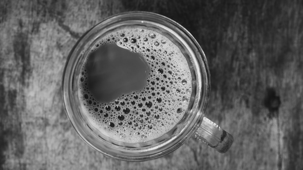 a close up of a cup of coffee on a table