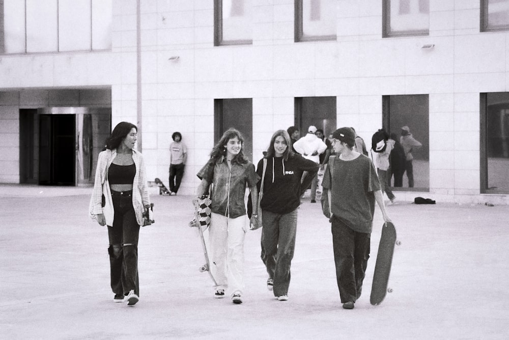 a group of young people walking down a street