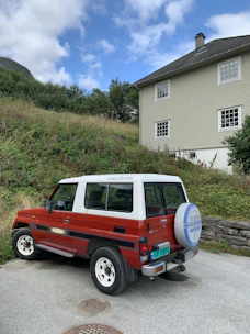A sleek Toyota Land Cruiser VXR parked on a sunny street in Guinea Conakry.