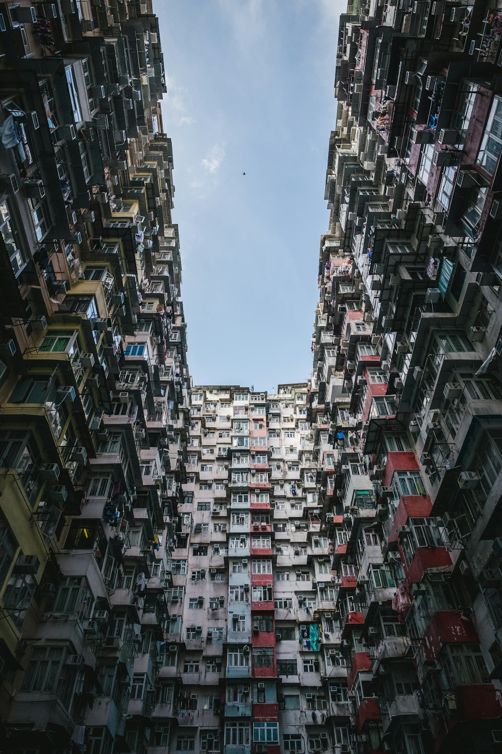 a very tall building with lots of windows and balconies