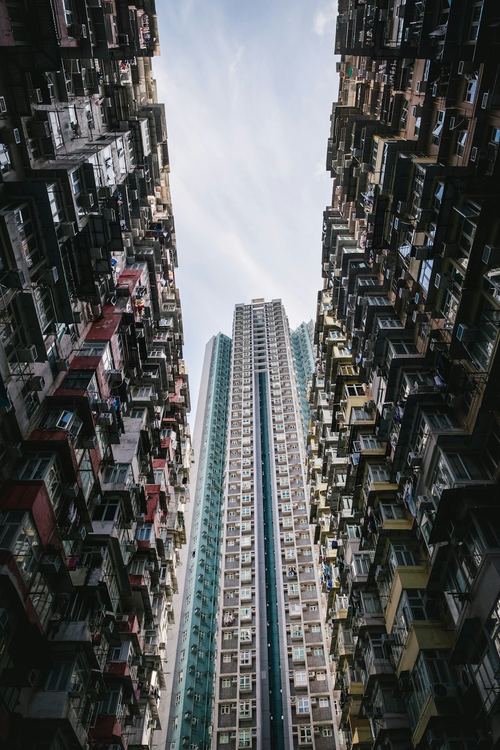 a tall building surrounded by other tall buildings