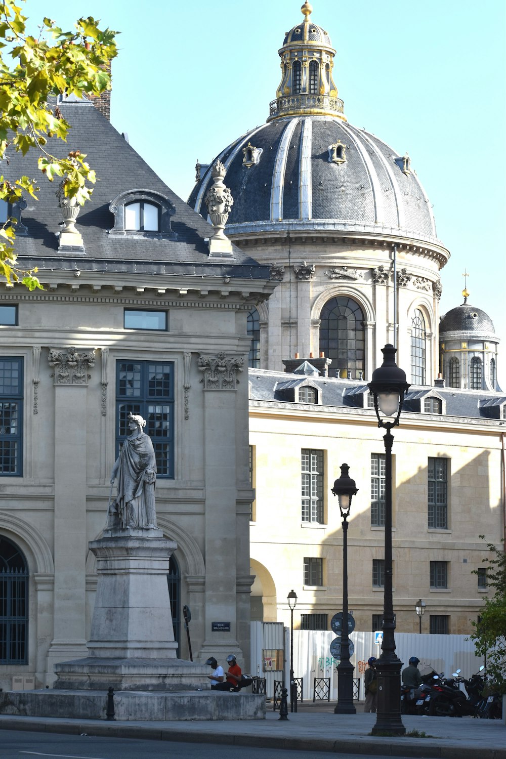 a large building with a statue in front of it