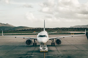 a large jetliner sitting on top of an airport tarmac