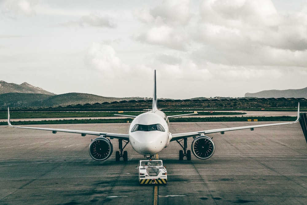 a large jetliner sitting on top of an airport tarmac