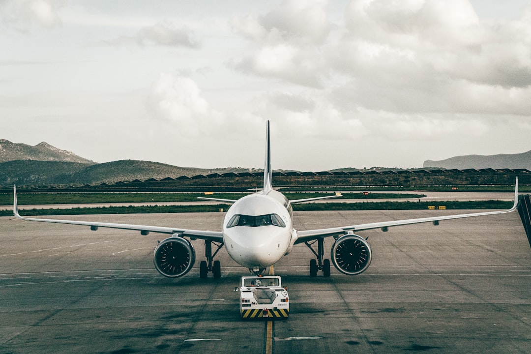 a large jetliner sitting on top of an airport tarmac,