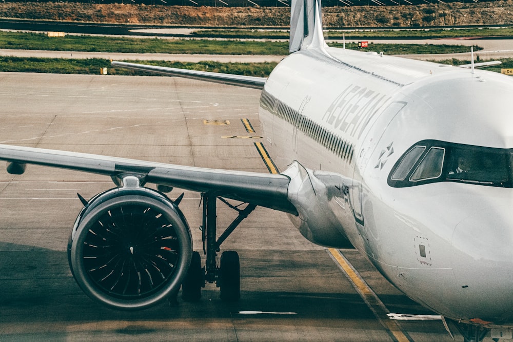 a large jetliner sitting on top of an airport tarmac