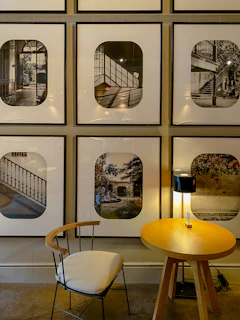 A chic black and white photographic print mounted in a sleek black frame displayed above a console table.