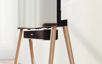 Sleek black smart TV displaying vibrant images in a modern living room