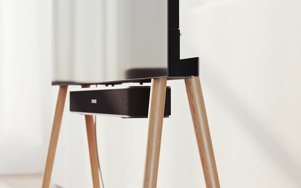 a mirror sitting on top of a wooden table