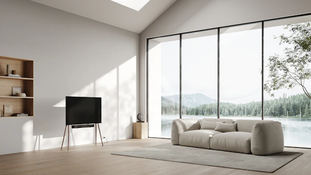 A serene living room with natural light and minimalist furniture arranged according to feng shui principles.