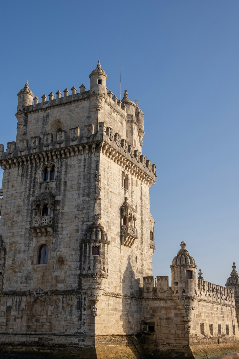 a tall tower with a clock on the top of it