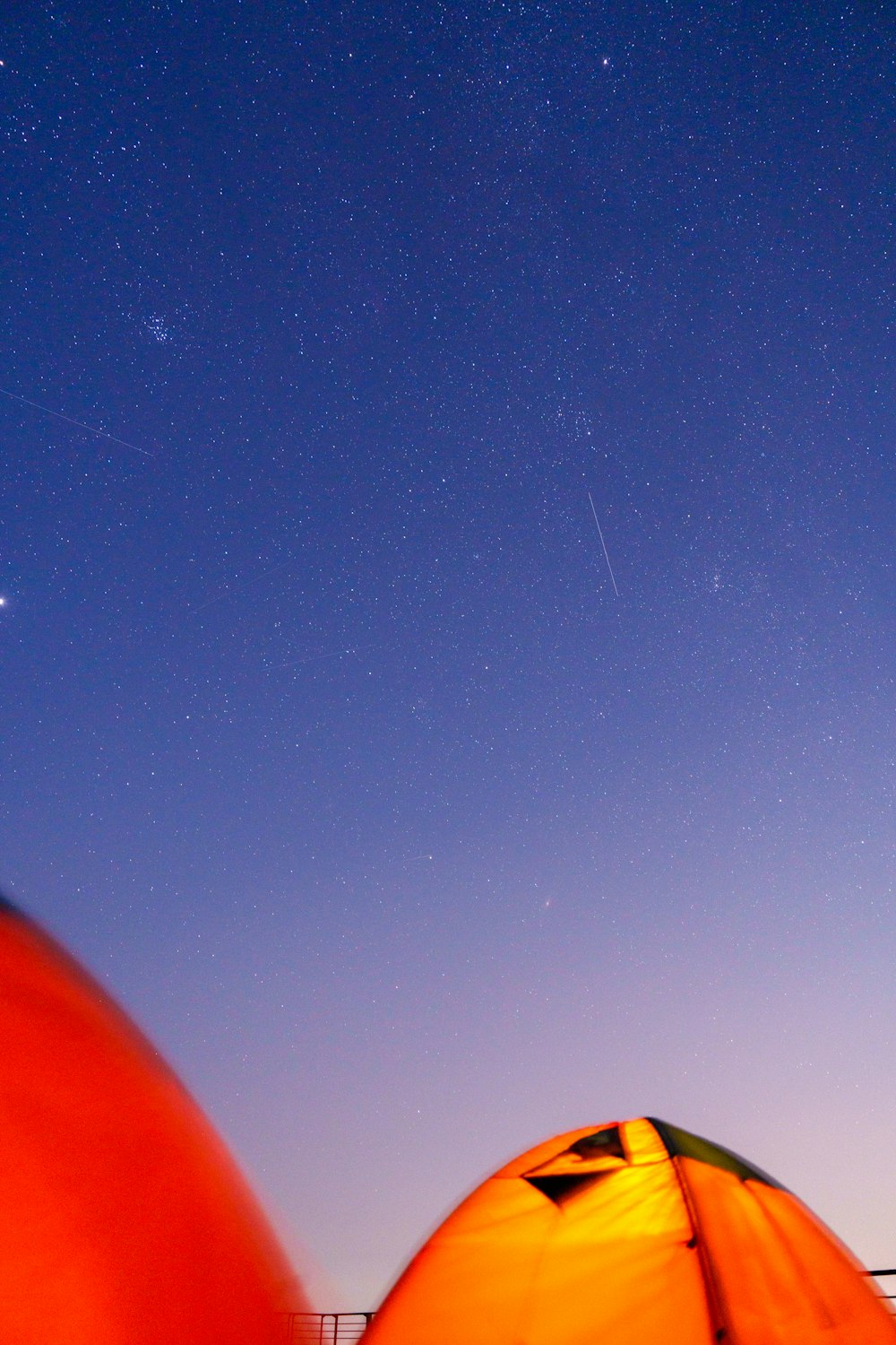 a view of the night sky from a tent