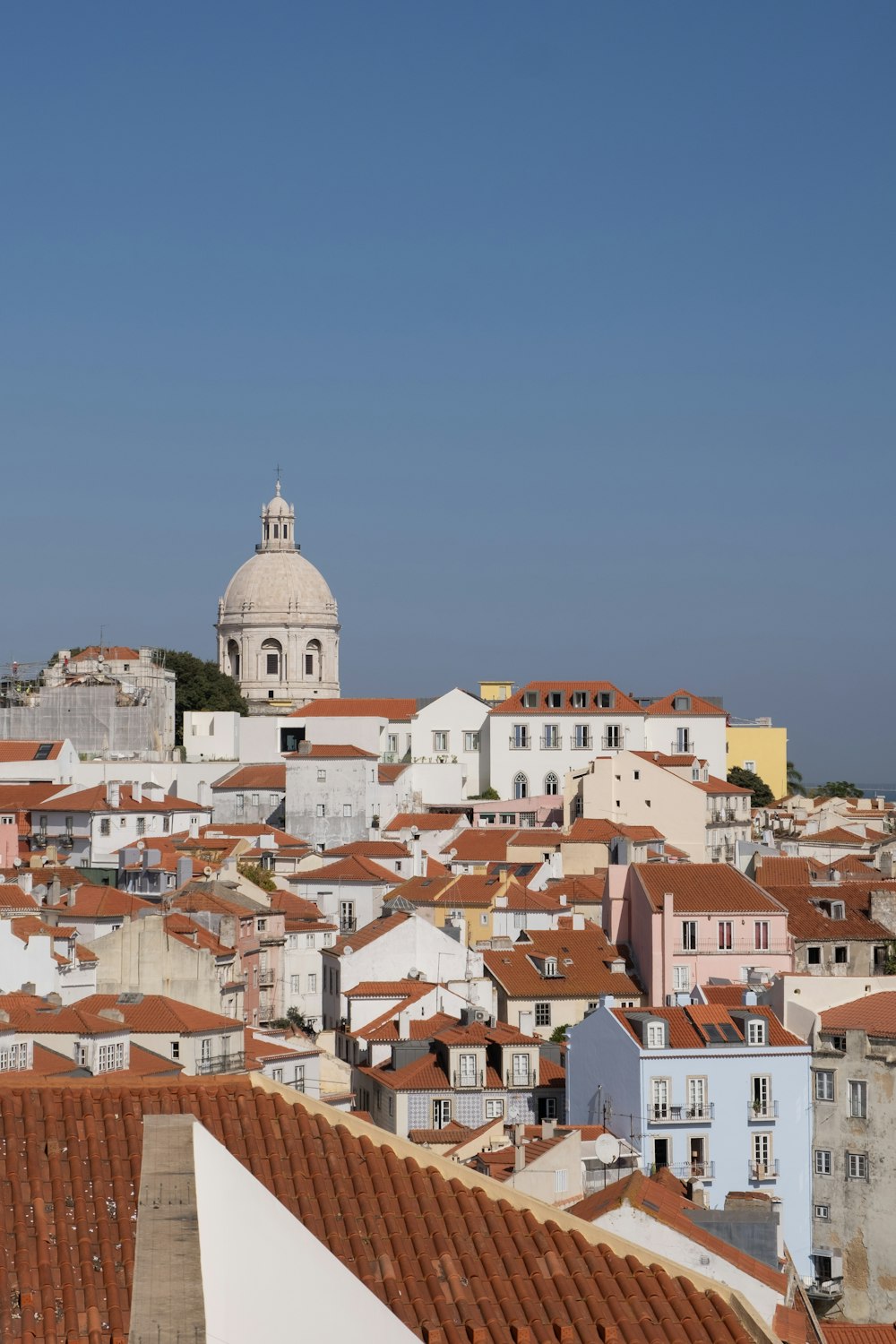 a view of a city with a church in the background