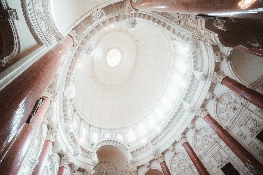 the ceiling of a large building with a dome