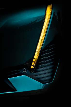 Dark background with yellow accents highlighting automotive parts icons arranged in a sleek grid.