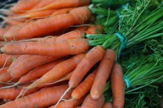 a pile of carrots sitting next to each other