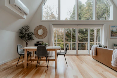 a living room filled with furniture and a wooden floor