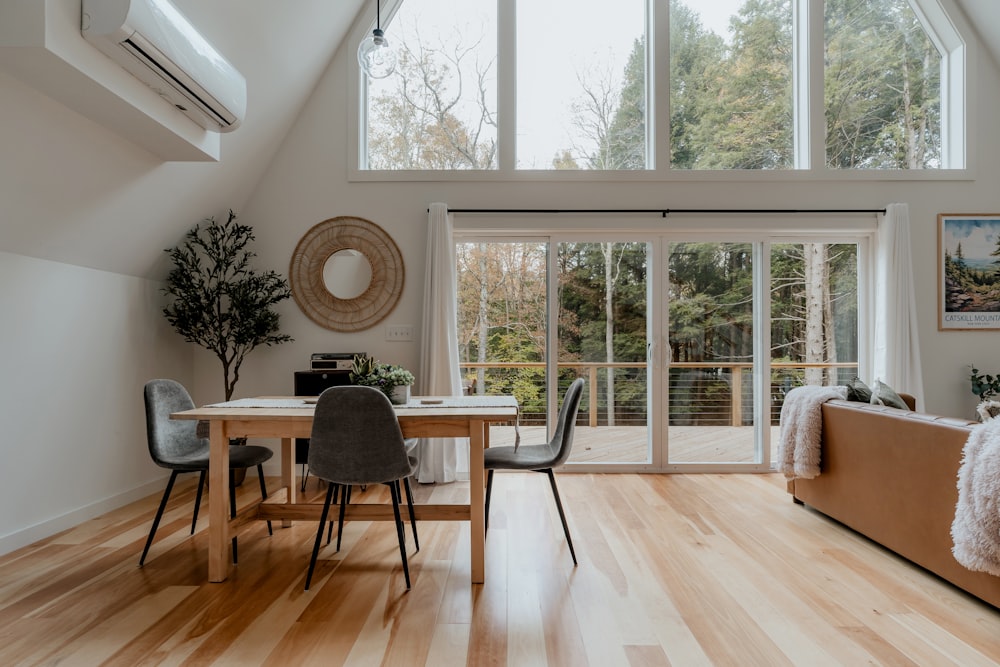 a living room filled with furniture and a wooden floor