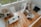 A spacious living room showcasing new hardwood flooring and stylish decor.