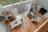 A spacious living room showcasing new hardwood flooring and stylish decor.