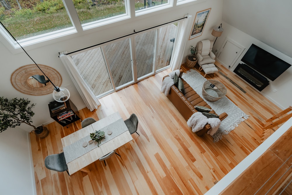 a view of a living room and dining room from above