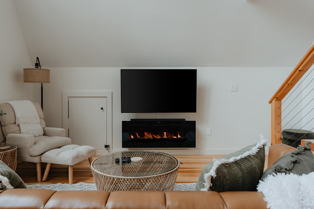 a living room filled with furniture and a fire place