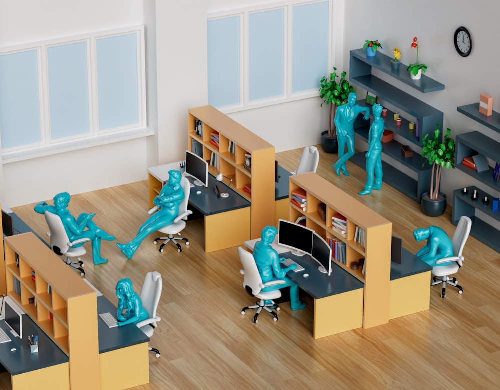 a group of desks with blue figures on them