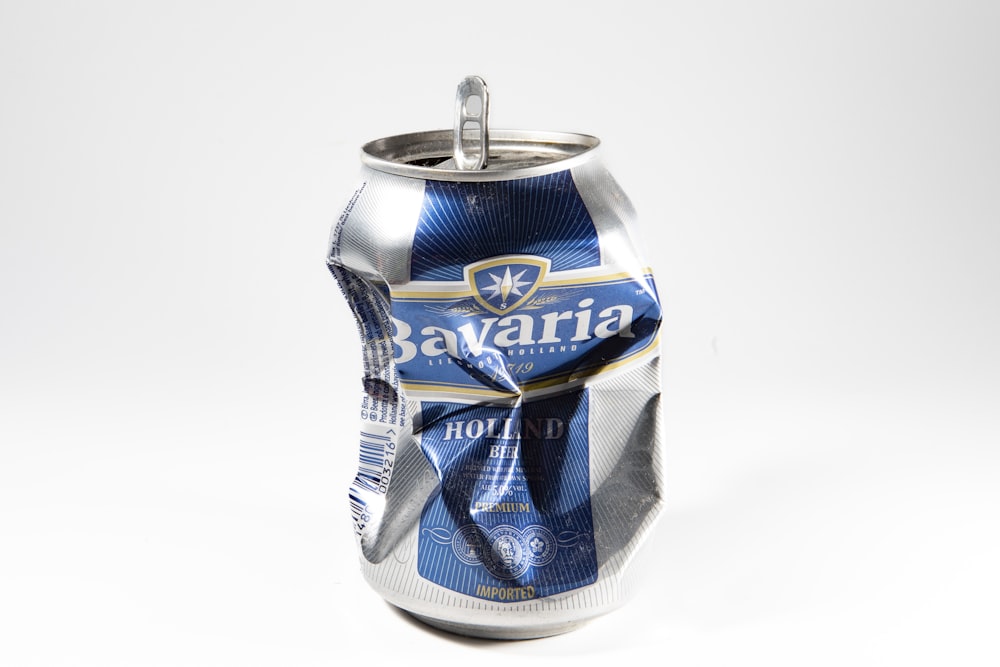 a close up of a can of beer on a white background