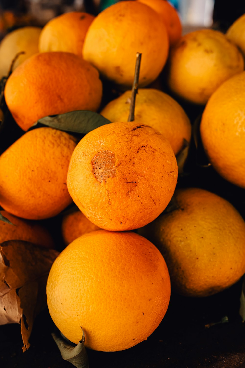 a pile of oranges sitting on top of each other