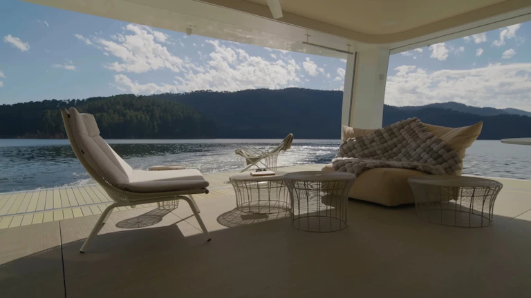 Comfortable outdoor seating area overlooking the peaceful lake and forest.