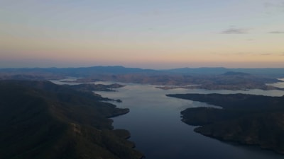 Photograph of a serene landscape painting with soft pastel colors.