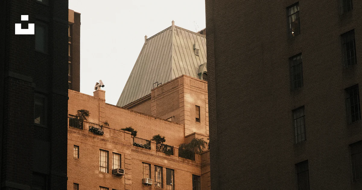 A view of a tall building from a distance photo – Free Building Image ...