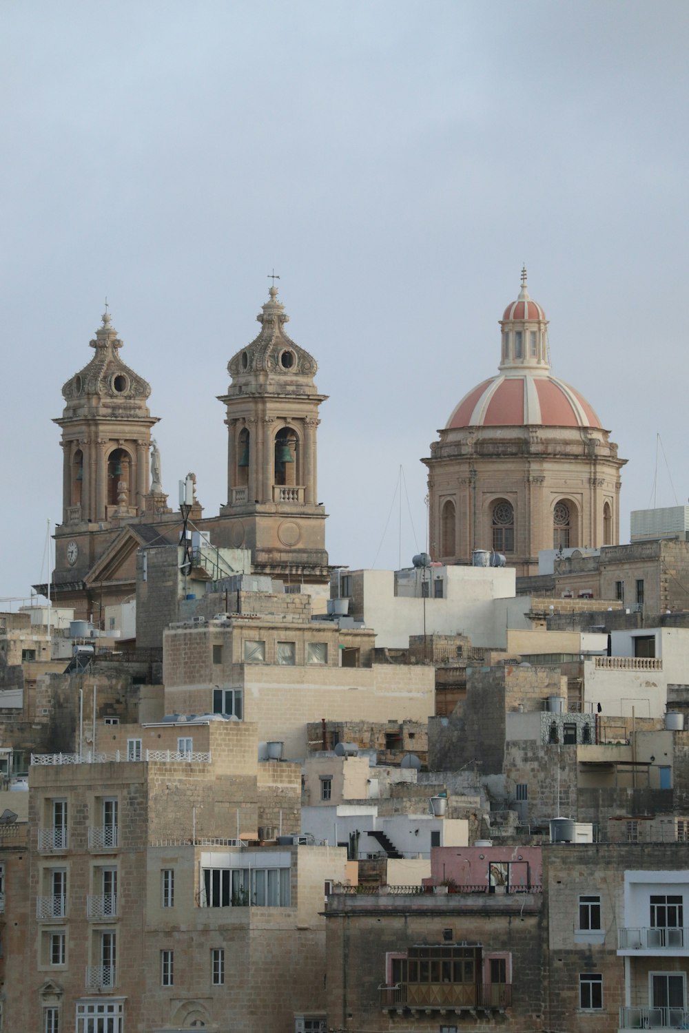 a view of a city with two large buildings