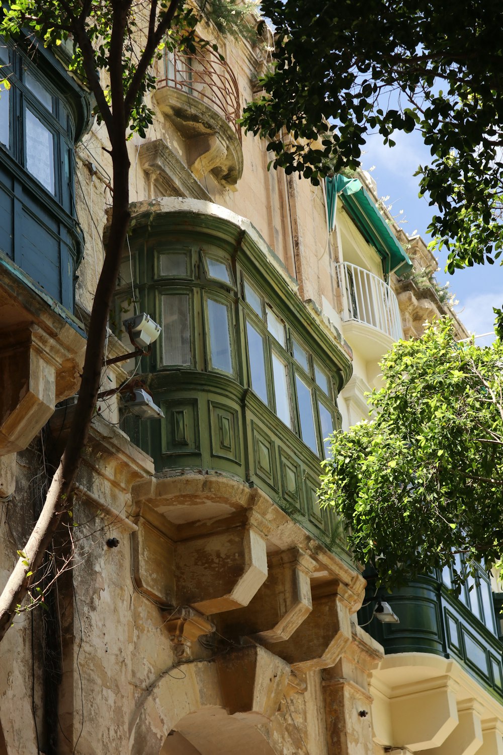 a tall building with a tree in front of it