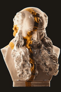a bust of a man with a beard and a beard ring