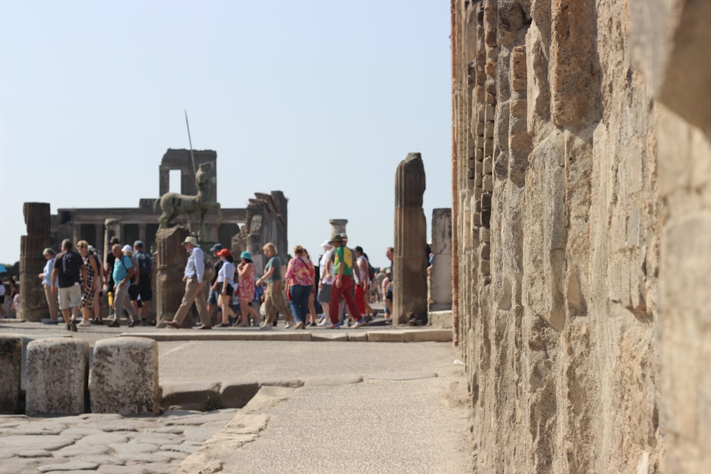 a group of people walking down a street