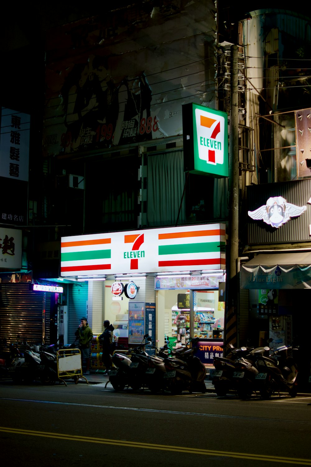 a gas station with motorcycles parked in front of it