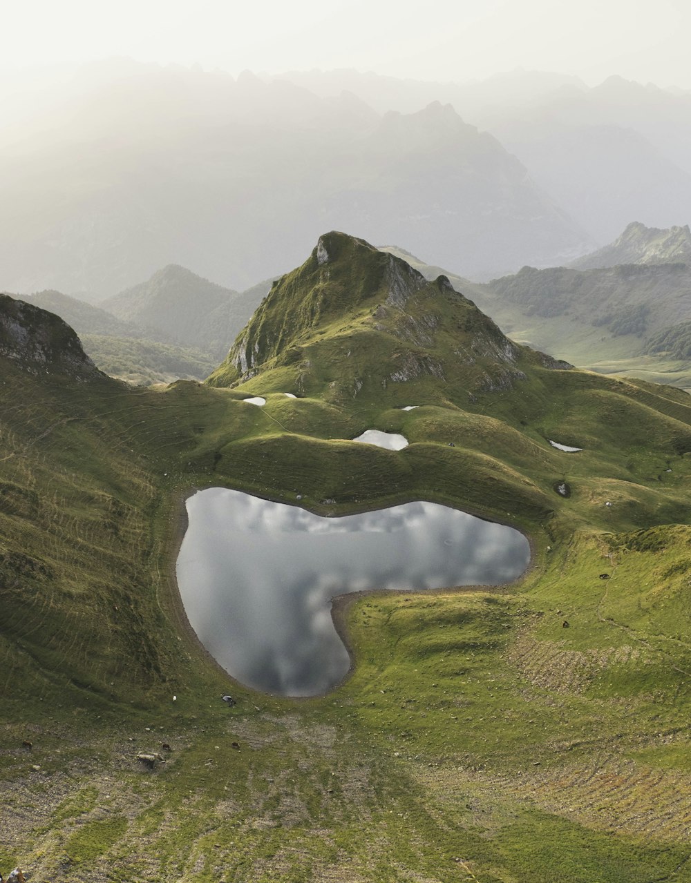 a mountain range with a lake in the middle of it