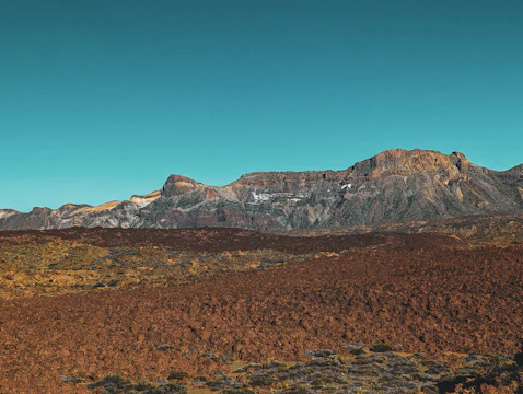 a view of a mountain range from a distance