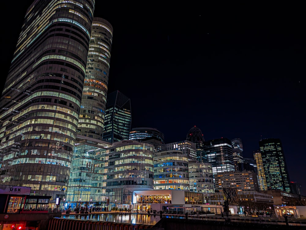 a city at night with a lot of tall buildings