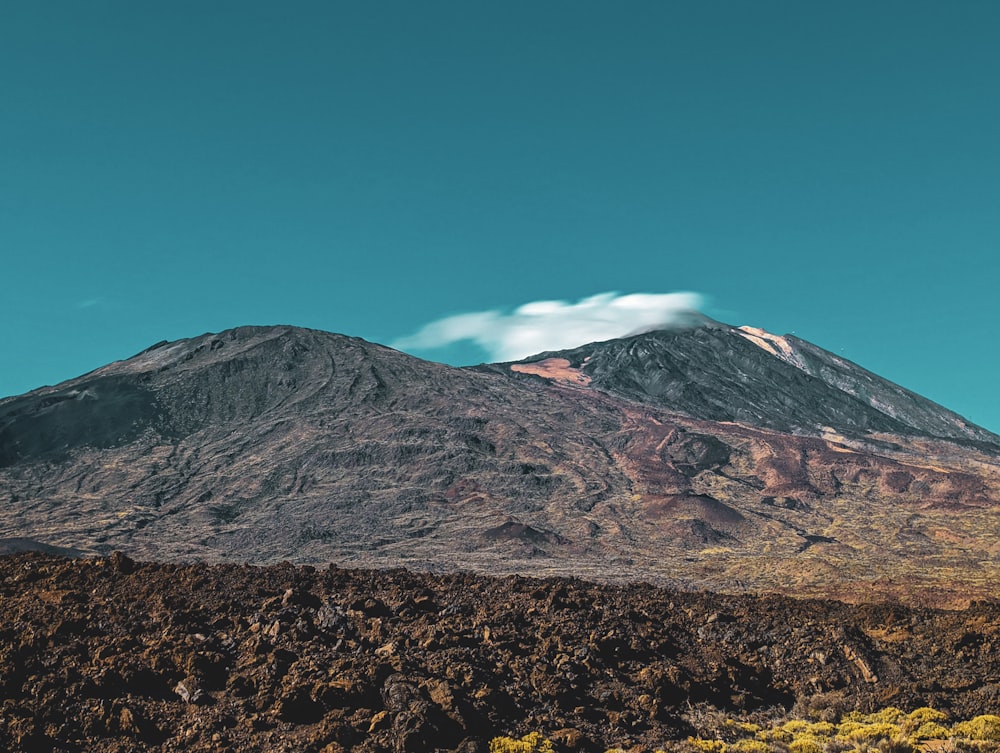 a mountain with a cloud in the sky