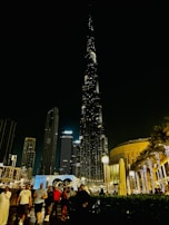 A night-time rendering of a commercial project illuminated by ambient lighting.