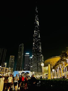 A night-time rendering of a commercial project illuminated by ambient lighting.